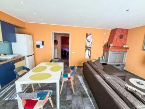 a living room with a couch and a table at Apartment Bellavista by Interhome in Porlezza