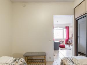 a bedroom with two beds and a living room at Holiday Home Yllästar 3 as 508 by Interhome in Äkäslompolo