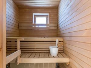 a wooden sauna with a toilet in it at Holiday Home Yllästar 3 as 508 by Interhome in Äkäslompolo +10 photos