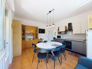 a kitchen and dining room with a table and chairs at Apartment Ca dei Noni by Interhome in Riva del Garda