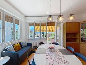 a living room with a table and a couch at Apartment Ca dei Noni by Interhome in Riva del Garda +34 photos