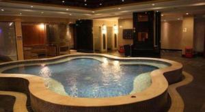 a large swimming pool in a hotel room at The Clipper Hotel in Dongguan