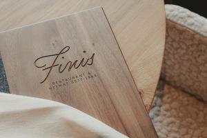 a book sitting on top of a bed at Aktiv & Spa Hotel Alpenrose in Schruns