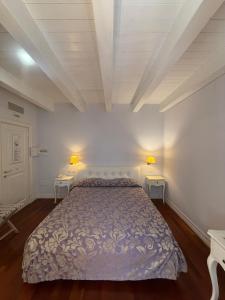 a bedroom with a bed and two night stands at Albergo Centrale in San Ginesio