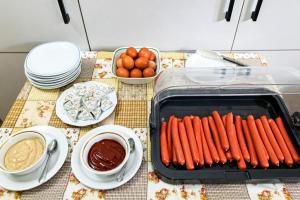 a table with a tray of carrots and chocolate sauce at Horská chata LADA in Loučná pod Klínovcem +68 photos