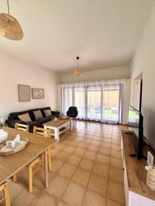 a living room with a couch and a table at Tajora House by Best Holidays Fuerteventura in La Oliva +23 photos