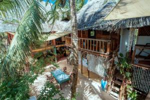an aerial view of a house with a palm tree at Peace House Zanzibar in Bwejuu