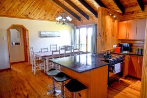 a kitchen and dining room with a table and chairs at Rivers End Farm Stanford - Cabins in Stanford