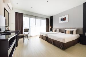 Somerset Park Suanplu Bangkok客房内的一张或多张床位