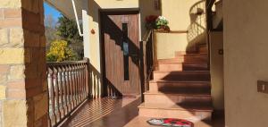 a pair of flip flops sitting on the porch of a house at HOLIDAY HOUSE LE COCCINELLE in Salò