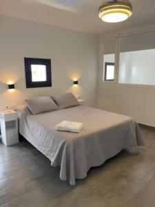a bedroom with a bed with two towels on it at Pozo, 22 in Fuente Palmera +28 photos