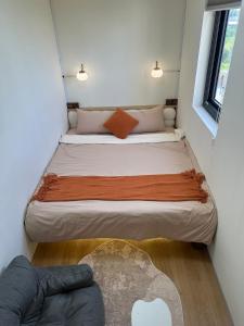 a bedroom with two beds in a small room at 流浪秘境Wanderland in Green Island