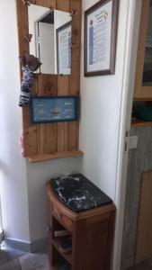 a bathroom with a wooden vanity and a mirror at La Bouee, entre Manche et Seine in Saint-Nicolas-de-la-Haie +25 photos