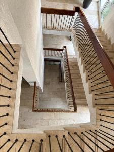 a spiral staircase in a building with wooden railings at Boardinghouse am Wall in Salzgitter-Bad