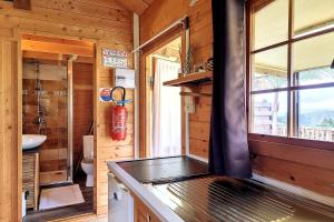 a bathroom with a toilet and a sink and a window at Le Yucca - Terrasse et jardin - Wifi in Saint-Louis +9 photos