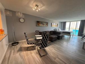 a living room with a couch and a table at Apartments Miami in Sunny Isles Beach