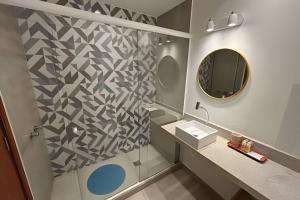 a bathroom with a sink and a mirror at Hotel Residence in Rio de Janeiro +44 photos