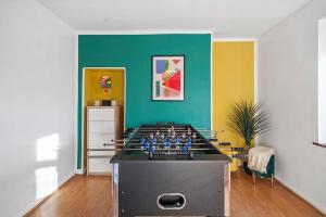 a room with a foosball table in the middle at Spacious 3BED Home in Rugby - Ideal for Groups in Clifton upon Dunsmore