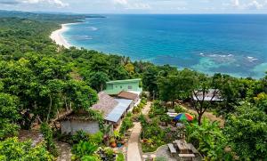 an aerial view of a house and the ocean at Le Panpurie Koh Lanta Resort - Near the Beach in Ko Lanta