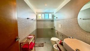 a bathroom with a sink and a toilet and a tub at Experience the Pool View Dream at Estrella Dominicus in Bayahibe +13 photos