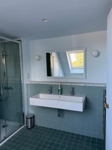 a bathroom with a sink and a shower at The Old Manse, Horton in Horton +34 photos