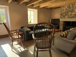 a living room with two chairs and a couch at The Old Manse, Horton in Horton