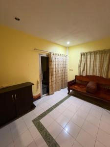 a living room with a bed and a window at Jano House in Ban Mae Nam