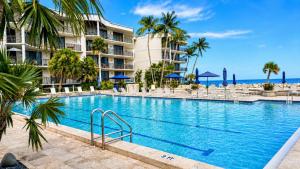 a swimming pool in front of a resort at Paradise Found Cayo Hueso in Key West