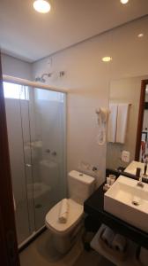 a bathroom with a toilet and a shower and a sink at Sea Paradise Hospedagem in Fernando de Noronha +41 photos