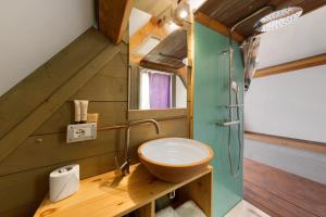 a bathroom with a sink and a toilet in a room at Glamping Le Ginestre in Monteverdi Marittimo +73 photos
