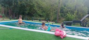 a group of people in a swimming pool at Kmetova Bajka in Janja