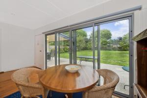 a dining room with a wooden table and chairs at Anderson in Apollo Bay