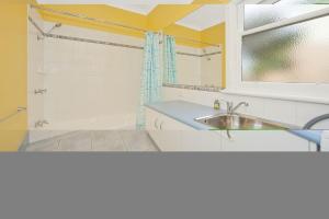 a bathroom with a sink and a shower at Anderson in Apollo Bay +3 photos