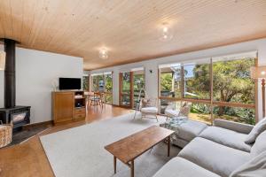 a living room with a couch and a table at Atwood in Aireys Inlet