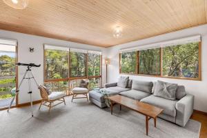 a living room with a couch and a table at Atwood in Aireys Inlet