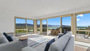 a living room with a view of the ocean at Majestic Views in Marengo