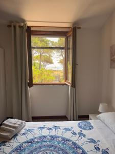a bedroom with a bed and a window at Al Mare Home in Pula +64 photos