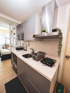 a kitchen with a sink and a counter top at Z Crib - Azure North in San Fernando