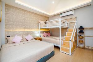 a bedroom with a bunk bed and a ladder at Good Pool Villa Luxury in Ban Hui Yai Muk +43 photos