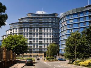 a large blue building with cars parked in front of it at Oakdale at Centrium in Woking