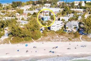 an aerial view of a beach with a yellow circle at Family Tides in Holmes Beach