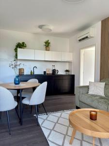 a living room with a couch and a table at Cozy Apartment with Castle view in Staré Mesto