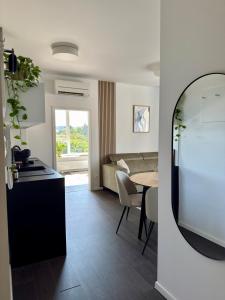 a kitchen and a living room with a table at Cozy Apartment with Castle view in Staré Mesto +15 photos