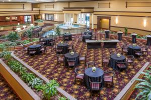 a banquet hall with tables and chairs and a pool at Holiday Inn Cincinnati-Eastgate by IHG in Eastgate