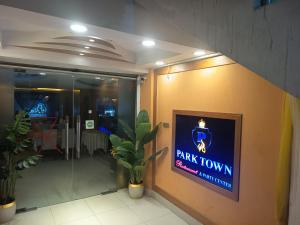 a dark town sign on the side of a building at HOTEL AL SAFA INTERNATIONAL, Ashkona in Dhaka