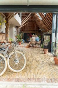 a group of bikes parked on a brick patio at Uitgerust voor Zaken in Heerenveen