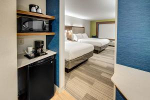 a hotel room with two beds and a tv at Holiday Inn Express Woodbridge by IHG in Avenel +66 photos