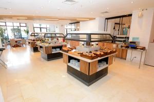 a restaurant with several tables in a room at Holiday Inn Istanbul City by IHG in Istanbul