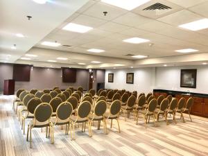a room with rows of chairs and a podium at Holiday Inn Express Hotel & Suites Somerset Central by IHG in Somerset +82 photos