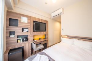 Voodi või voodid majutusasutuse Hotel M's Plus Shijo Omiya toas